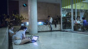 A popular wifi zone is in front of the Havana Libre hotel, which was a Hilton before Fidel Castro seized it. Image: David Osit for Motherboard